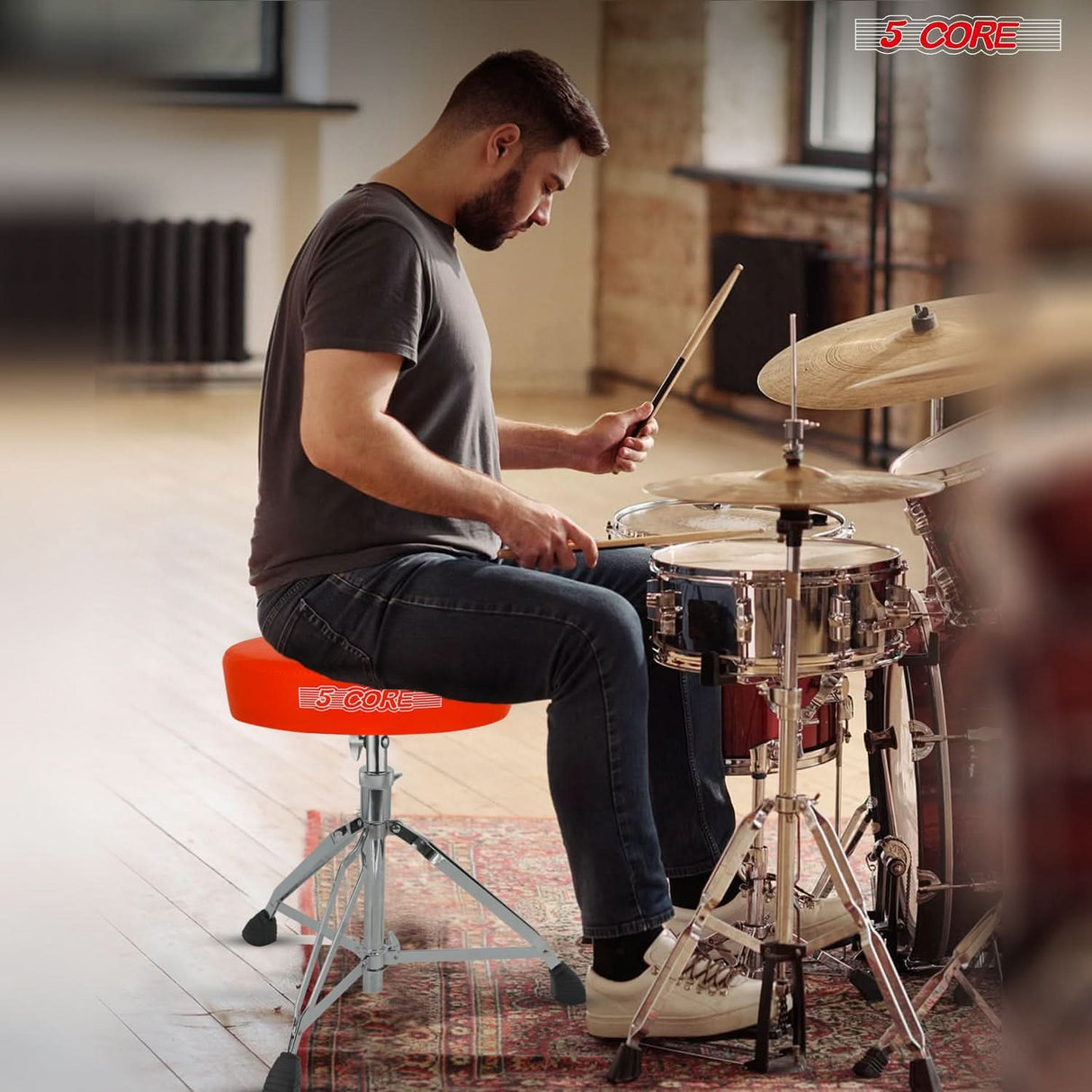 Drummer’s adjustable stool with built-in snare drum pad